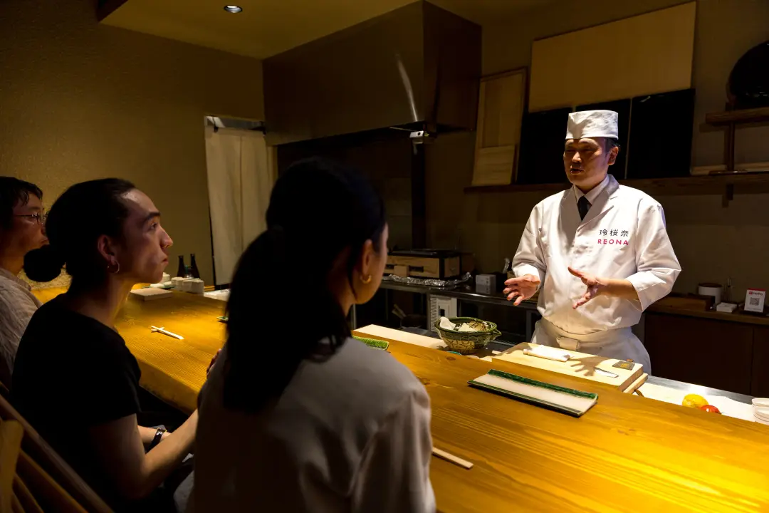 Guest interacting with sushi chef at the counter