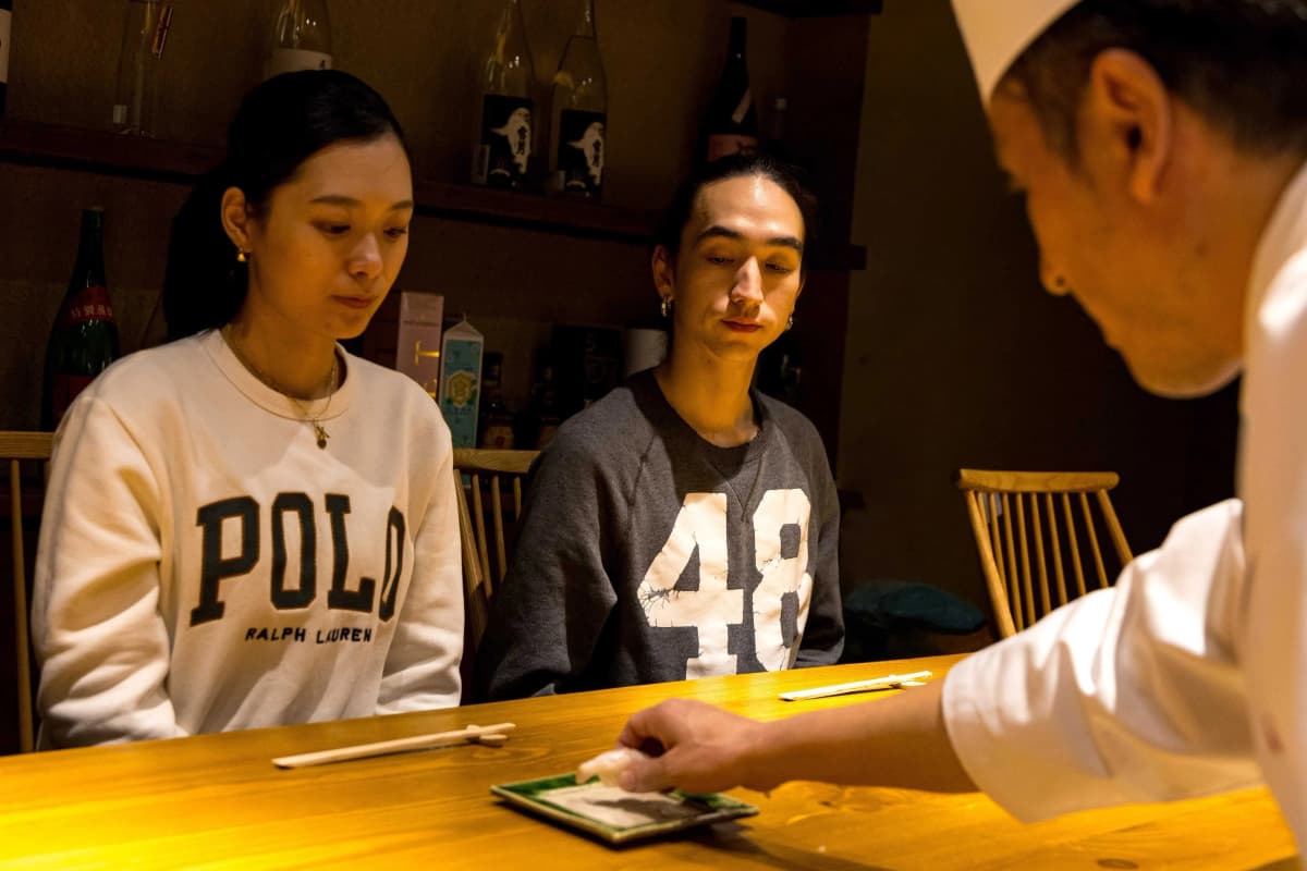 Guest enjoying omakase experience with the sushi master