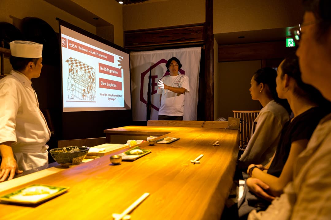 English presentation about sushi traditions at REONA